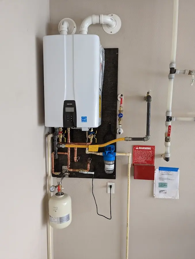 Professional plumber installing copper piping in a Canyon home